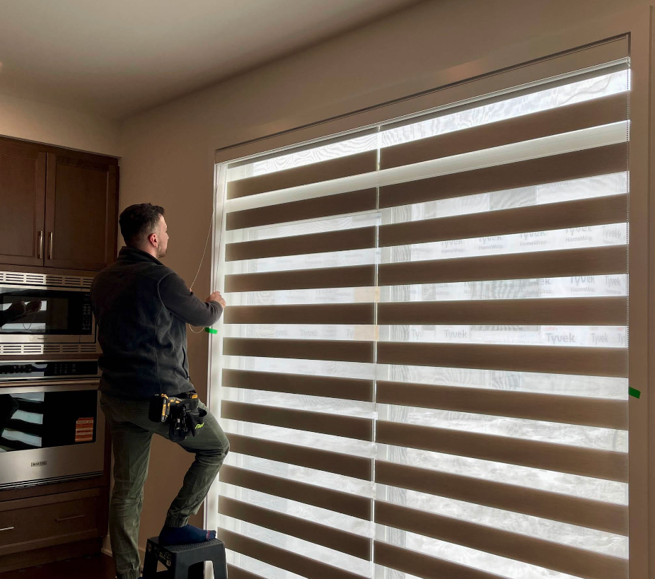 The Blind certified installer measuring a window in an Ottawa home